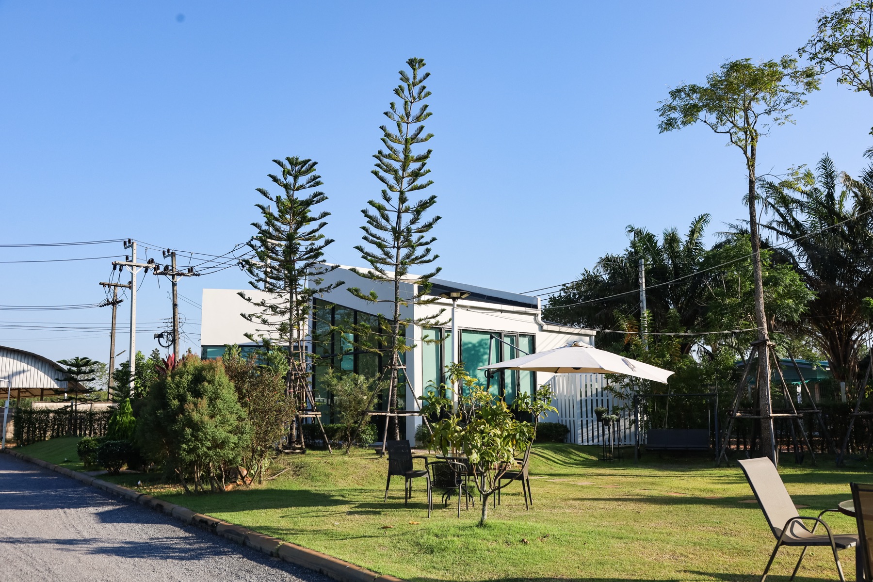 Myrrh Cafe glass building exterior surrounded by trees