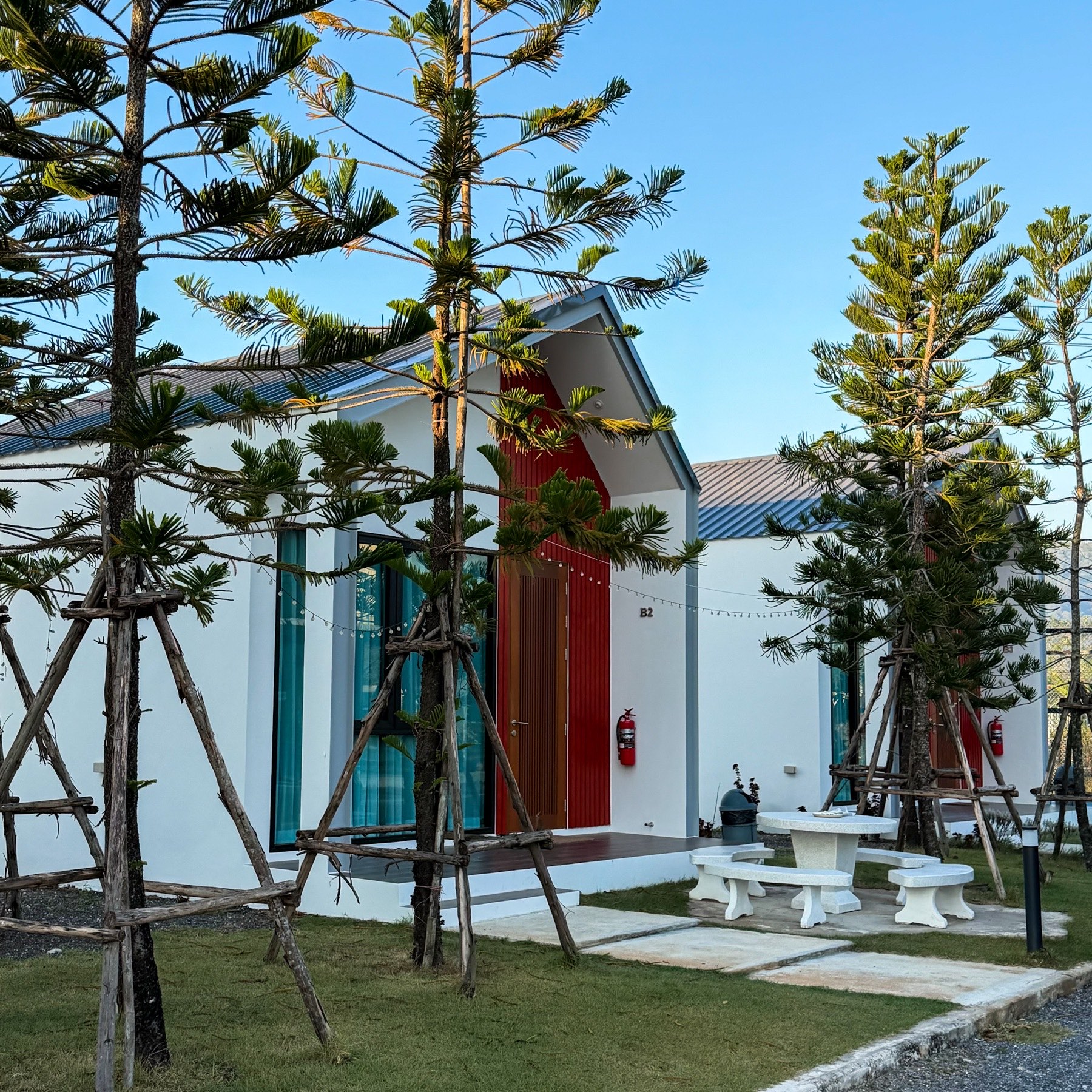 Deluxe House exterior with private terrace at golden hour