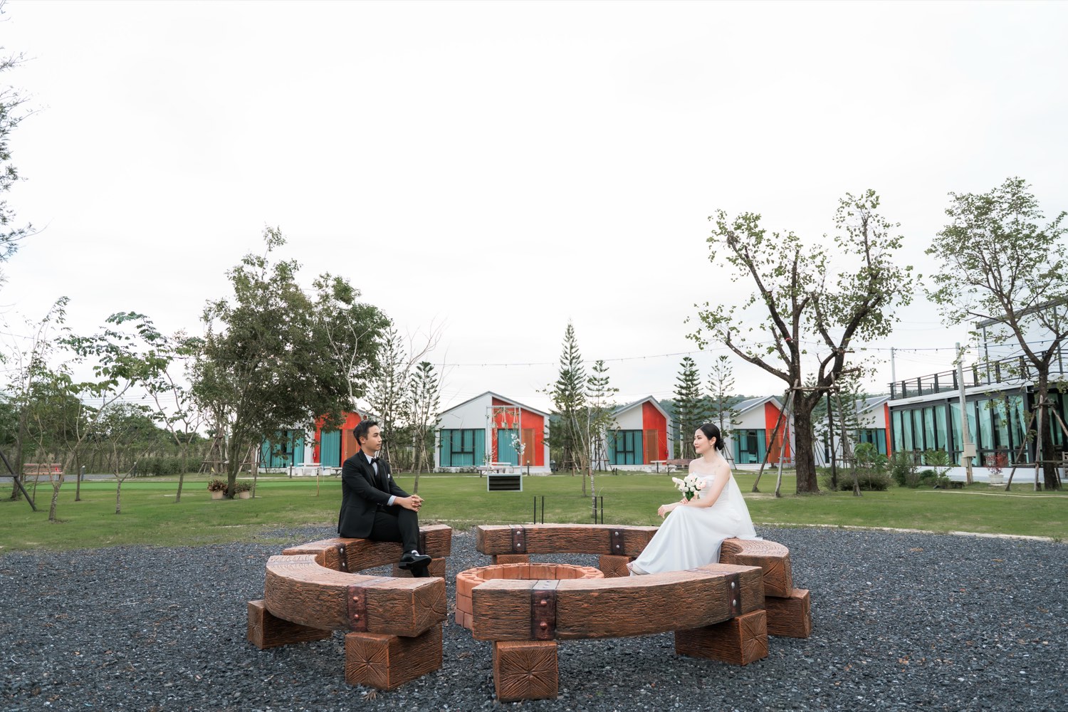 Wide view of the resort grounds with villas and a wedding couple